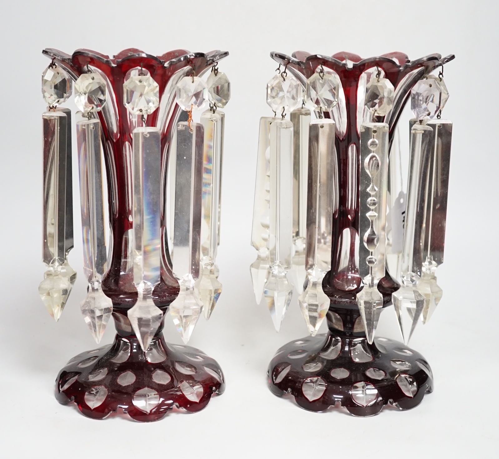 A pair of Victorian ruby overlaid glass table lustres, 28cm